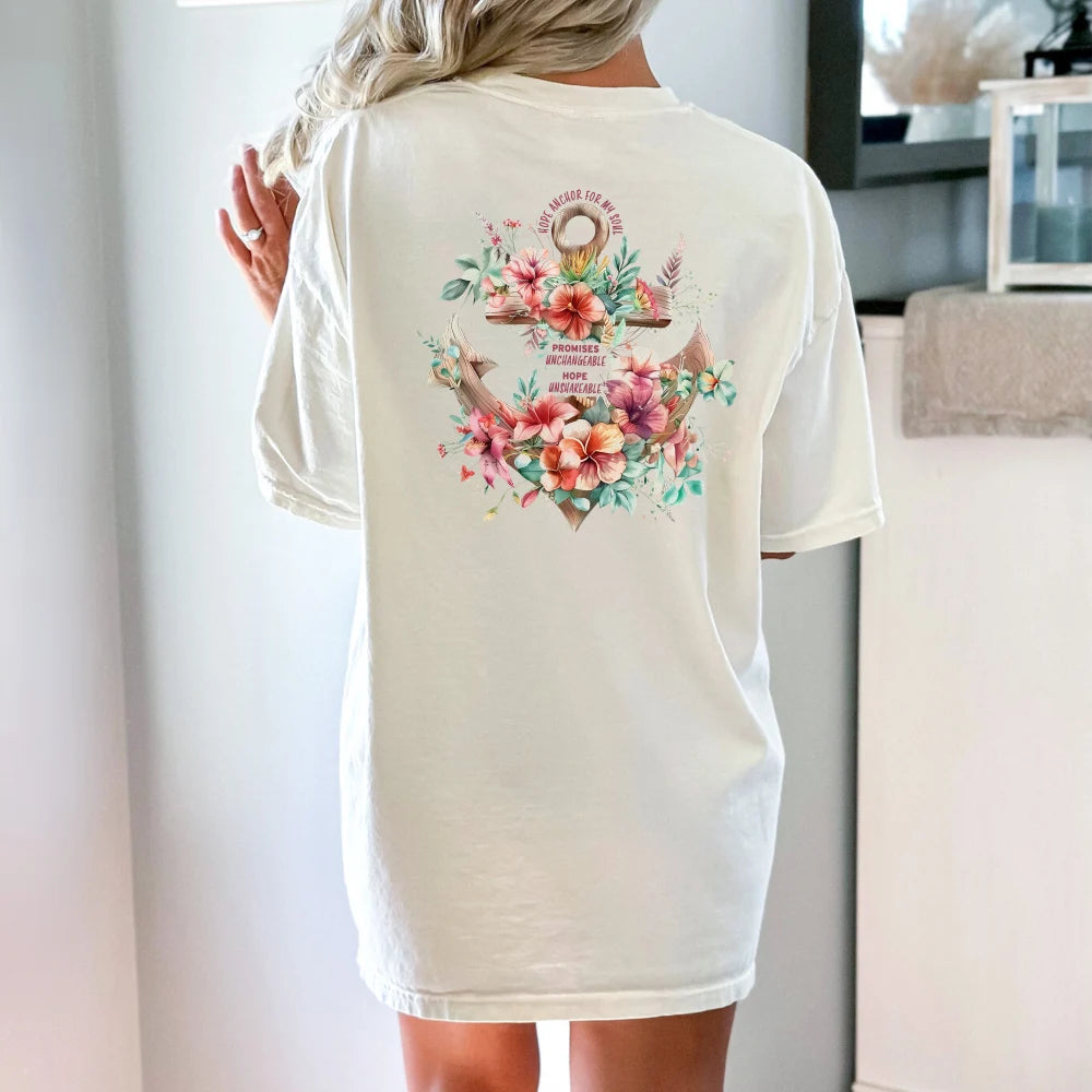 Woman wearing a white oversized Hope Anchor Floral Shirt with Hawaiian flowers and an island-themed design on the back by Be Still and Know.