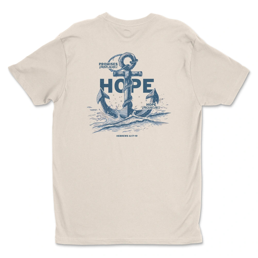 A beige Hope Anchors shirt from Be Still and Know with a graphic of an astronaut rising from ocean waves, surrounded by the word "eternal hope" and some text.