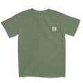 Olive green God Means It For Good shirt with a small white logo on the left chest by Be Still and Know.
