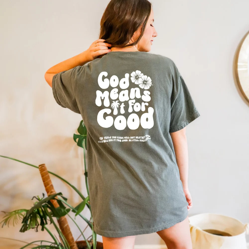 Woman displaying the back of her God Means It For Good Shirt by Be Still and Know, emanating unshakeable joy.