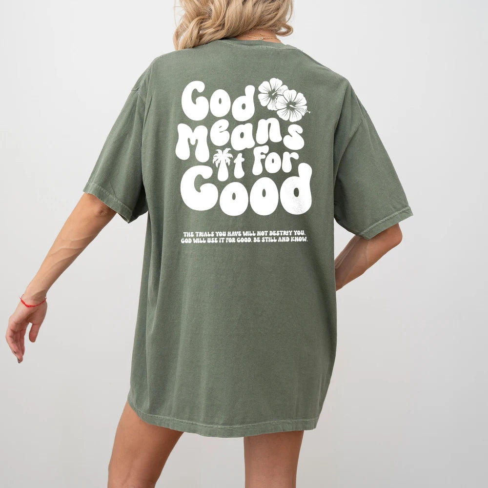 A person wearing a Be Still and Know God Means It For Good Shirt in green with the phrase "God grows new life" printed on the back.