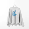 A Be Still and Know Kupa'a Tide Sweatshirt with a blue wave on it.