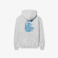 The Be Still and Know Kupa'a Tide Hoodie features a blue wave on its grey fabric, representing unwavering faith.