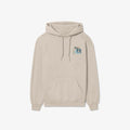 A beige Nalu o ka Mana (Waves of Faith) hoodie with an image of a dog on it, perfect for Be Still and Know Clothing enthusiasts.