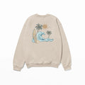 A beige Nalu o ka Mana (Waves of Faith) sweatshirt featuring a palm tree and wave design, perfect for Christian clothing enthusiasts from the Be Still and Know brand.