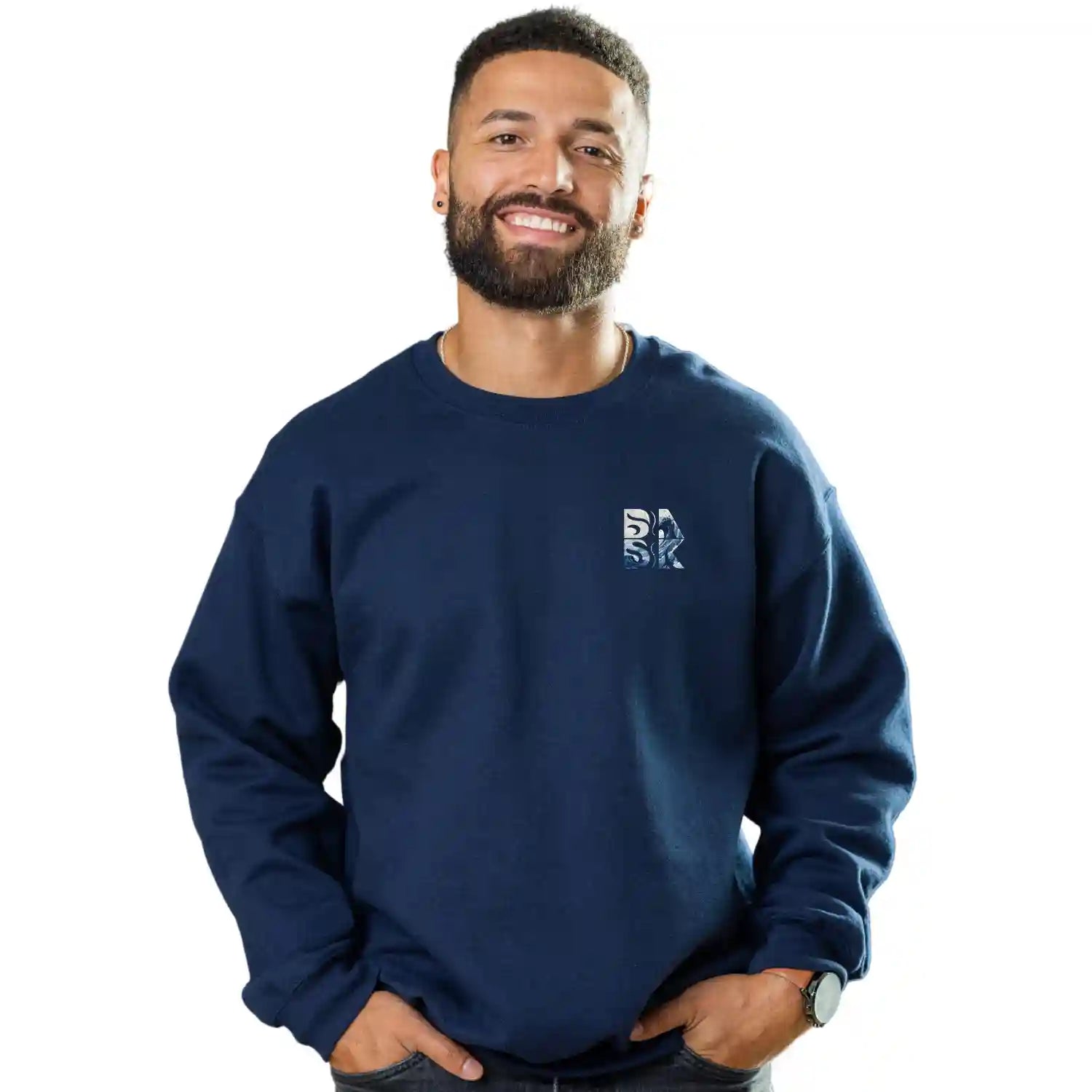 A man with a beard wearing a navy Peace Be Still Sweatshirt featuring the Be Still and Know Logo.