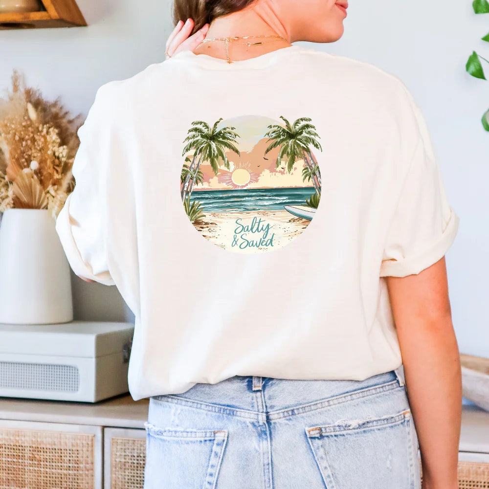 A woman wearing a Be Still and Know Salty & Saved Shirt with a tropical beach design and the names "Sally & David" printed on the back.