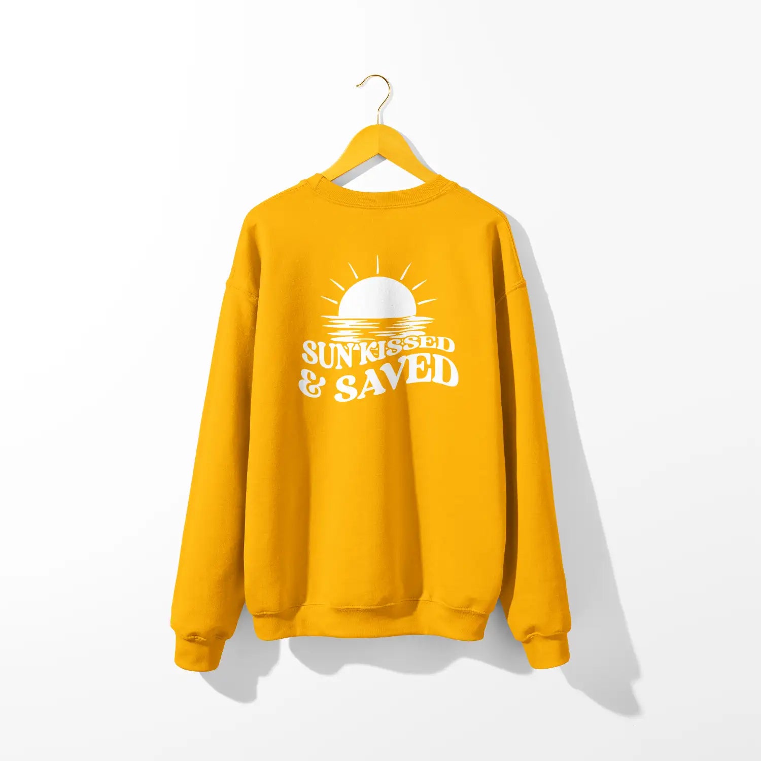 A yellow Sunkissed & Saved Sweatshirt from the brand Be Still and Know, with the word 'sun' on it, representing faith.
