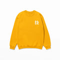 A Sunkissed & Saved Sweatshirt by Be Still and Know, with a white logo on it that provides warmth.