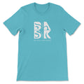 A Coastal Calm Tee In Turquoise with the Be Still and Know logo on it.