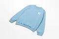 A light blue Water Walking Faith Sweatshirt with the letter r on it, perfect for those looking for Christian Clothing from the brand Be Still and Know.