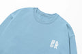 A blue Water Walking Faith sweatshirt with a white Be Still and Know logo on it.