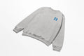A Kupa'a Tide Sweatshirt with blue letters on it, perfect for Be Still and Know Christian Apparel.