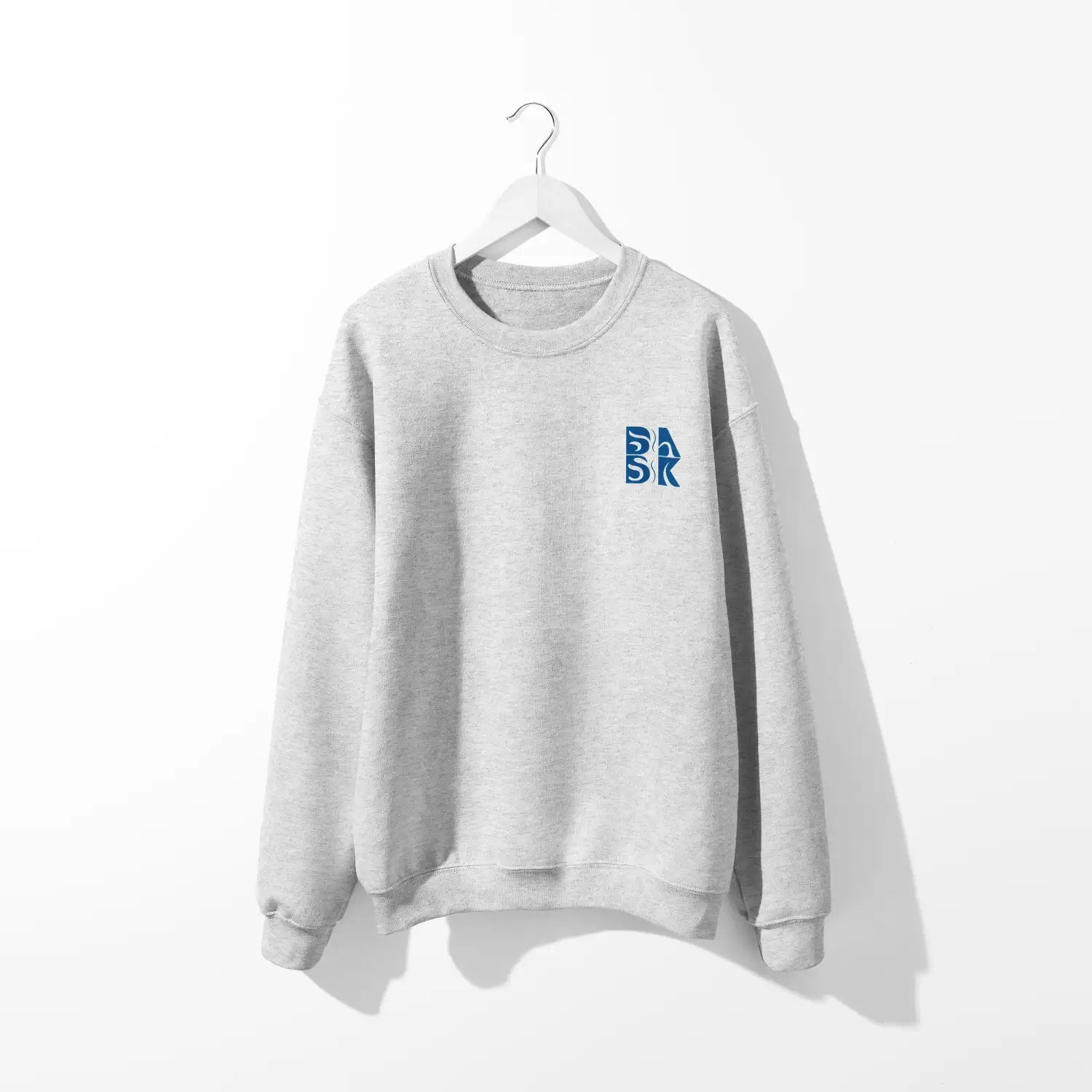 A Kupa'a Tide Sweatshirt by Be Still and Know with the letter BSAK Logo on it.